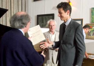 Pawel Popko receiving the diploma.